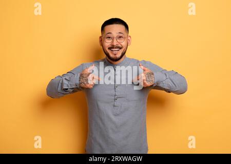 Choose Me. Happy Excited Asian Man Pointing At Himself With Two Hands Stock Photo