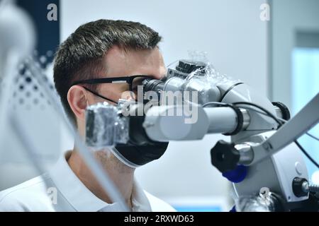 Dentist Using Microscope With Camera In Dental Clinic. Medical Inovation Concept. Close Up Stock Photo
