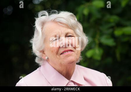 Portrait of a cheerful female senior - John Gollop Stock Photo