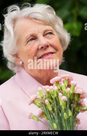 Portrait of a cheerful female senior - John Gollop Stock Photo