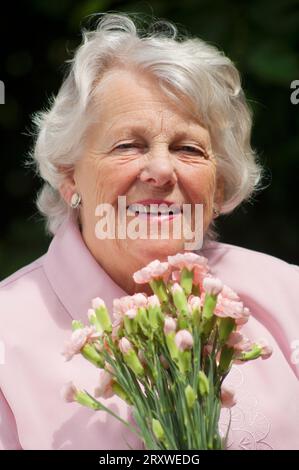 Portrait of a cheerful female senior - John Gollop Stock Photo