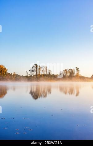 Morning mist in the lake at autumn Stock Photo