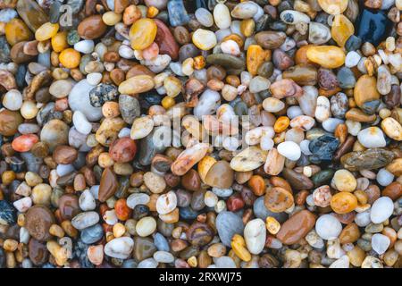 Close up colorful pebble stones at the beach in Porto, Portugal. Stock Photo