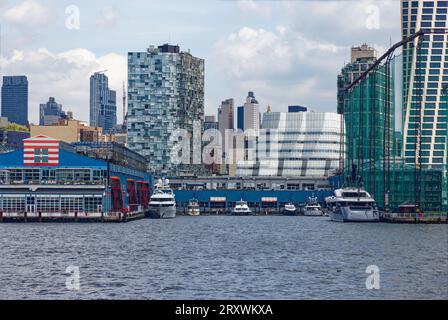 Chelsea Piers sports/entertainment complex spans three Hudson River piers; 100 11th Avenue condo and IAC Headquarters stand behind. Stock Photo