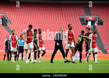 AMSTERDAM - (l-r) Devyne Rensch of Ajax, Josip Sutalo of Ajax, Jorrel Hato of Ajax, Ajax coach Maurice Steijn, Chuba Akpom of Ajax leave the field disappointed after the Dutch premier league match between Ajax Amsterdam and Feyenoord Rotterdam in the Johan Cruijff ArenA on September 27, 2023 in Amsterdam, Netherlands. The match will be played without an audience. The game was finally stopped on Sunday after 55 minutes with Feyenoord taking a 3-0 lead after repeated fireworks on the field. ANP OLAF KRAAK Stock Photo