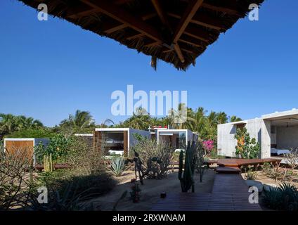 View from main house to bedroom modules. Casa Leria, Puerto Escindido, Mexico. Architect: TAC Taller Alberto Calleja , 2023. Stock Photo