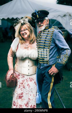 Steam punk festival with men and women dress in Victorian style Sci fi costumes in outdoor setting Stock Photo