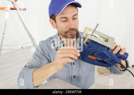 a worker operating cutting machine Stock Photo