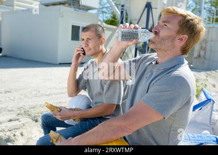 two workers having a lunch break Stock Photo