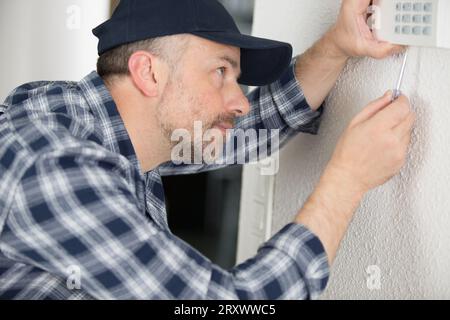 technician working on setting panel Stock Photo