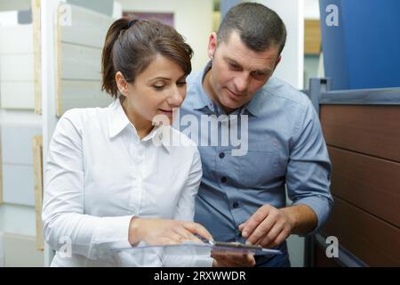 portrait of cheerful couple who is shopping in store Stock Photo