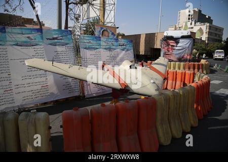 September 26, 2023, Tehran, Iran: A locally-made drone is pictured next to the portrait of Iranian Supreme Leader Ayatollah Ali Khamenei, during a military exhibition commemorating the Iran-Iraq war (1980-88) anniversary, at Baharestan Square in downtown Tehran. Military equipment displayed by Iran's army and paramilitary Revolutionary Guard to celebrate 'Defence Week' marking the 43rd anniversary of the start of the 1980-88 Iran-Iraq war. Iran, which has for years been under crippling US and Western sanctions, has developed a vast domestic arms industry, with a large arsenal of missiles and d Stock Photo