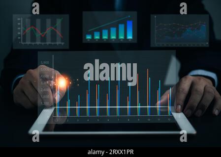 Business analysis big data screen and economic growth with financial graph. digital tablet marketing plan, Investment concept of virtual dashboard tec Stock Photo