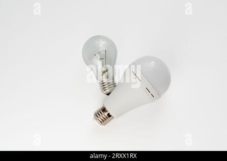 incandescent lamp and LED lamp on a white background. energy saving concept Stock Photo