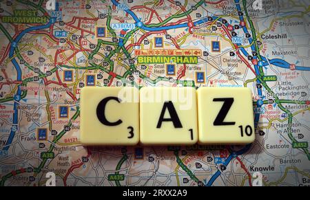 Birmingham city centre CAZ clean air zone, Scrabble letters and words on map of the West Midlands, England, UK, B3 2BS Stock Photo