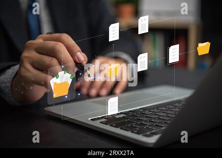 Document Management System or DMS. information technology IT working on laptop.Internet Document management Storage and Technology Concept. Stock Photo