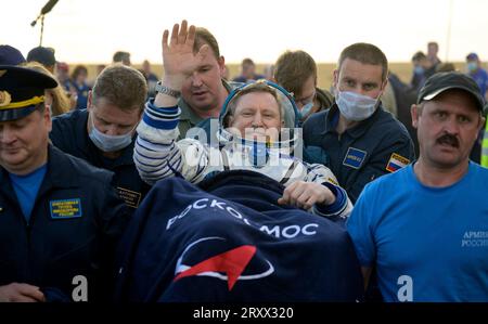 Zhezkazgan, Kazakhstan. 27 September, 2023. Expedition 69 Roscosmos cosmonaut Sergey Prokopyev waves as he his carried from the Russian Soyuz MS-23 spacecraft shortly after landing, September 27, 2023 in Zhezkazgan, Kazakhstan. Roscosmos cosmonauts Sergey Prokopyev, Dmitri Petelin and NASA astronaut Frank Rubio returned after 371 days aboard the International Space Station.  Credit: Bill Ingalls/NASA/Alamy Live News Stock Photo