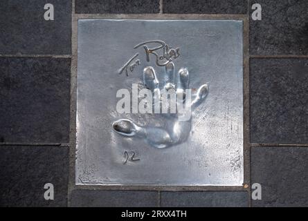 The handprint from famous American actor, writer, director, producer and activist Tim Robbins  set into the pavement of The Allée des Étoiles (Avenue Stock Photo