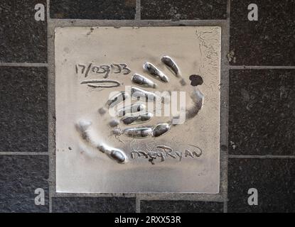 The handprint from famous American actress and film producer Meg Ryan set into the pavement of The Allée des Étoiles (Avenue of the Stars) in Cannes, Stock Photo