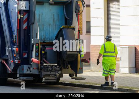 A small garbage can for plastic waste is emptied Stock Photo