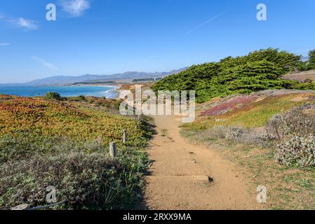 Deserted clifftop path running along the rugged coast of central California on a clear autumn day Stock Photo