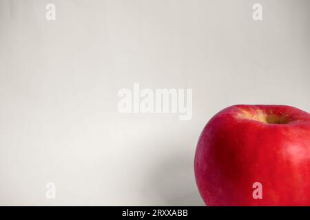 A Single Red Fuji Apple in a White Isolated Background Stock Photo