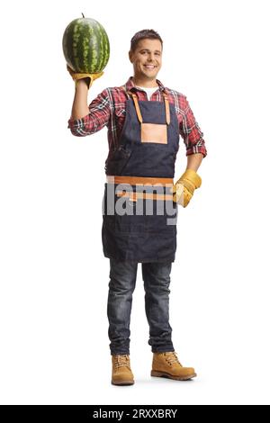 Farmer holding a watermelon with one hand and smiling isolated on white background Stock Photo