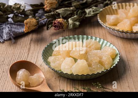 Old Rock sugar in a bowl on white background. Stock Photo