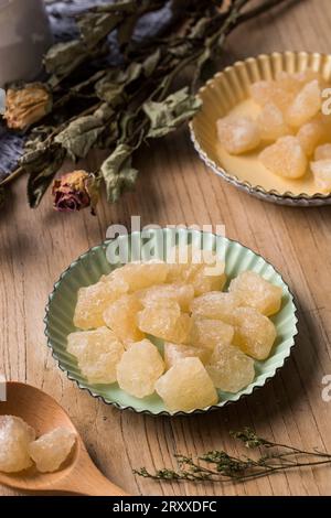 Old Rock sugar in a bowl on white background. Stock Photo