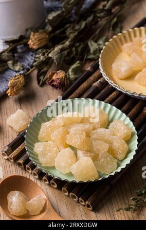 Old Rock sugar in a bowl on white background. Stock Photo