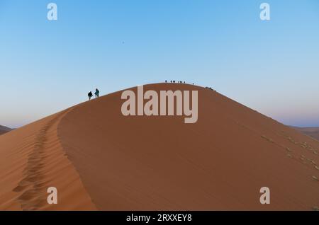 climbing dune 45 at the sunrise, namib desert Stock Photo