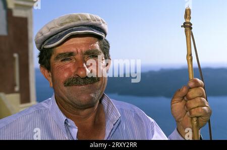 Fishermen in Thira, Santorini, Cyclades, Greece Stock Photo