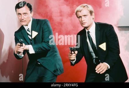 THE SPY IN THE GREEN HAT  1967 MGM film with Robert Vaughn at left and David McCallum Stock Photo