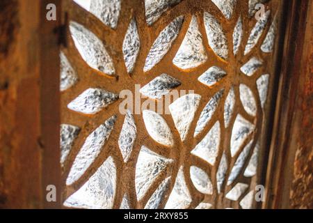 Close up shot of a perforated decorative iron screen Stock Photo