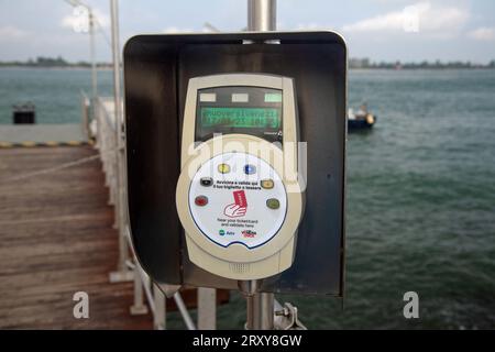 Punta Sabbioni, Cavallino-Treporti, Veneto, Italy, Information boards (in English) and a ticket validation machine at the port Stock Photo