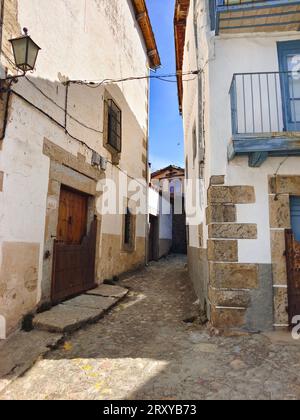 Street of village called Candelario in the center of Spain in a sunny day Stock Photo