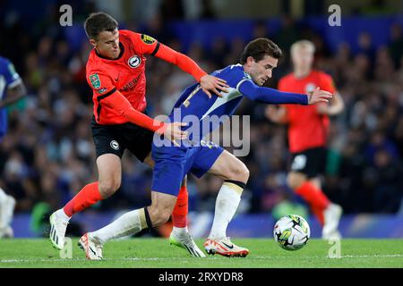 Chelsea's Ben Chilwell (right) and Brighton and Hove Albion's Solly March battle for the ball during the Carabao Cup third round match at Stamford Bridge, London. Picture date: Wednesday September 27, 2023. Stock Photo