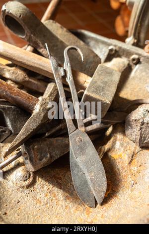 antique metal tools for traditional blacksmithing Stock Photo