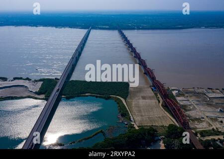 Aerial view of the Lalon Shah Bridge and Hardinge Bridge over the Padma River at Pakshi. Pabna, Bangladesh. Stock Photo