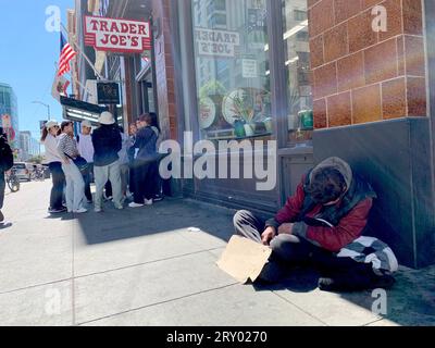 August 16, 2023, San Francisco, California, USA: A homeless man sleeps outside the Trader Joeâ€™s store near Market Street in San Francisco, California on Wednesday August 16, 2023. Many retailers are citing homeless problems and other challenges of operating in Downtown San Francisco and contemplating whether to remain open. (Credit Image: © David G. McIntyre/ZUMA Press Wire) EDITORIAL USAGE ONLY! Not for Commercial USAGE! Stock Photo