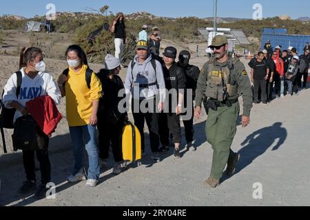 September 26, 2023, Jacumba Hot Springs, California, USA: Large groups of asylum-seekers arrive to a makeshift camp near the Jacumba Hot Springs desert, an unincorporated area, following their crossing from Mexico into the United States in east San Diego, California on Tuesday, September 26, 2023. Migrants continue to arrive to desert campsites along the US-Mexico border, as they await to be processed by US Border Patrol in tents made from tree branches. (Credit Image: © Carlos A. Moreno/ZUMA Press Wire) EDITORIAL USAGE ONLY! Not for Commercial USAGE! Stock Photo