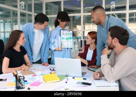 Team of employees working together at table in office. Startup project Stock Photo