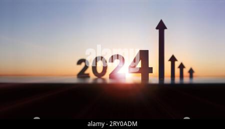 Arrows and graphs rising high, 2024 new year sunrise and bright rising sun and stock finance economic growth and success, investment goals Stock Photo