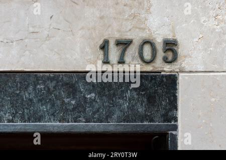 one thousand seven hundred five metal ancient house number, concept number Stock Photo