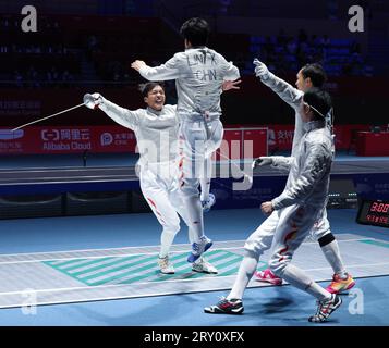 (230928) -- HANGZHOU, Sept. 28, 2023 (Xinhua) -- Team China celebrate after the Men's Sabre Team Semifinal of Fencing at the 19th Asian Games in Hangzhou, east China's Zhejiang Province, Sept. 28, 2023. (Xinhua/Xu Yu) Stock Photo