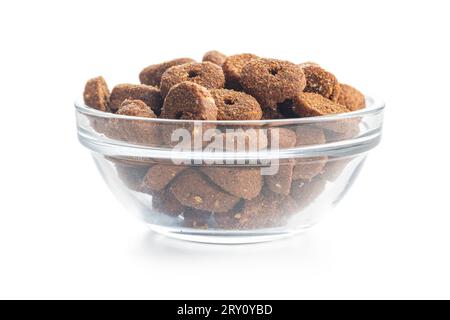 Dry animal food. Dog or cat kibble in bowl isolated on the white background. Stock Photo