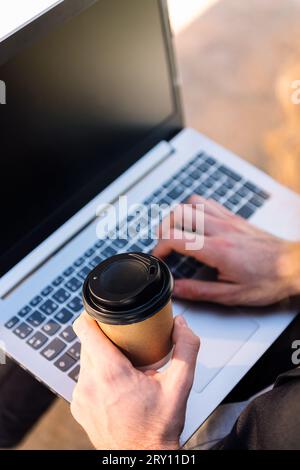 unrecognizable man working with a laptop Stock Photo