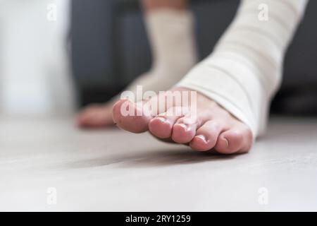 man using put on elastic bandage with legs having leg pain Stock Photo