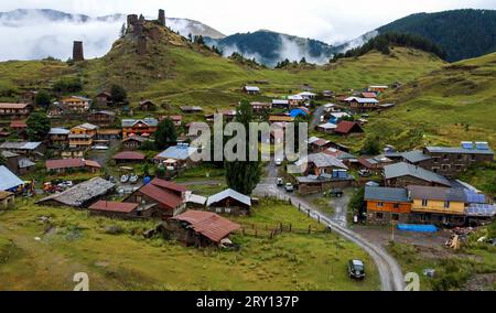 Aerial scenic view of old ruins of monastery above rural village Omalo in Caucasus mountains, Tusheti region of Georgia country. Medieval architecture Stock Photo