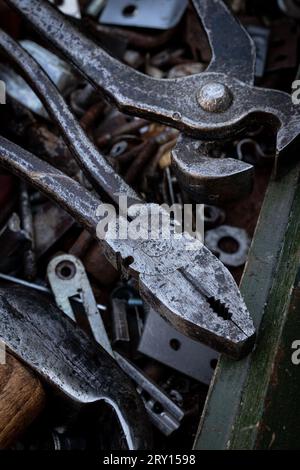 Old work tools lie on a wooden tool box Stock Photo